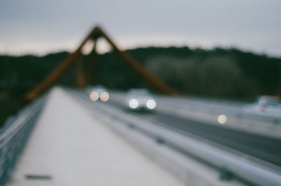 Defocused image of vehicles on bridge