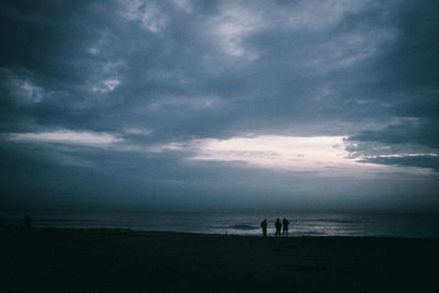 Scenic view of sea against sky at dusk