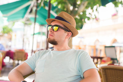 Portrait of young man wearing hat