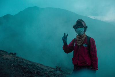 Full length of man standing on mountain