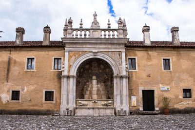 Padula, italy low angle view of historical building against sky