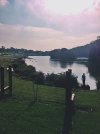 Scenic view of lake against sky during sunset