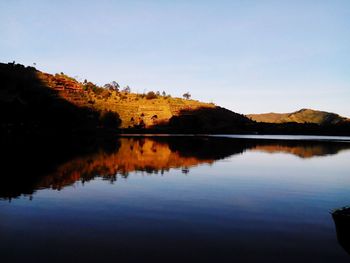 Scenic view of lake against sky during sunset