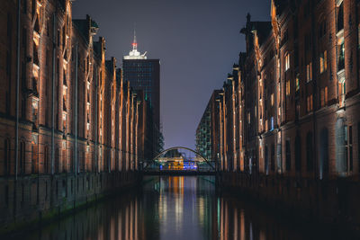 View of skyscrapers lit up at night