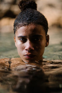 Portrait of young woman in sea