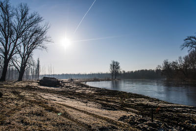 Scenic view of lake against sky during winter