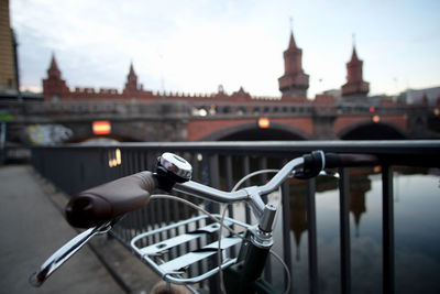 View of bicycle in front of berlin oberbaumbrücke bridge