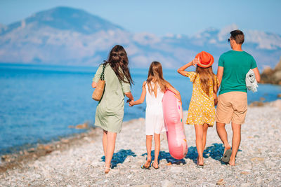 Rear view of women on beach