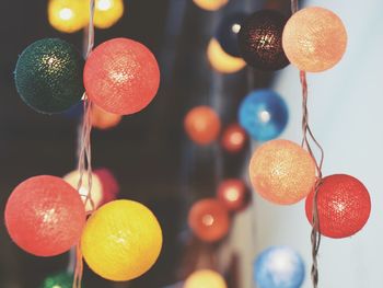 Close-up of fruits hanging on orange