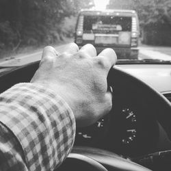 Close-up of hand holding car