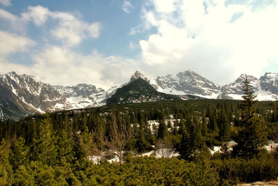 Scenic view of mountains against cloudy sky