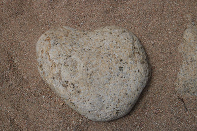 High angle view of heart shape on sand