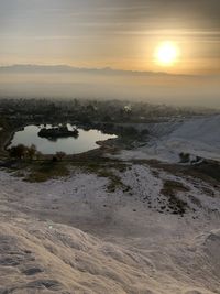 Aerial view of landscape against sky during sunset