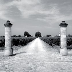 Empty road leading towards building