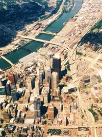 Aerial view of buildings in city on sunny day