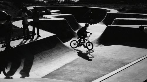 Low section of man cycling on bicycle