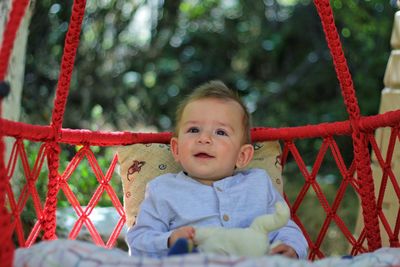 Portrait of cute babyboy sitting on playground