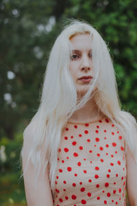 Close-up portrait of beautiful woman with long blond hair