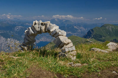 Scenic view of rocks and mountains against sky