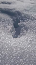 Close-up of wet snow against sky