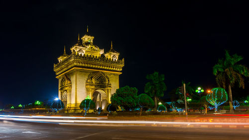 Illuminated city against sky at night