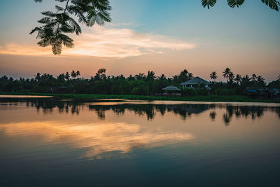 Scenic view of lake against sky during sunset