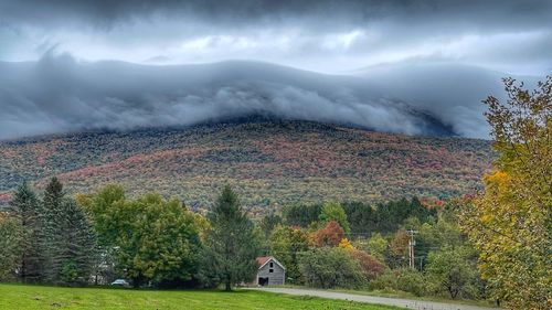 Scenic view of mountains against sky during autumn