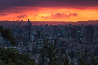 High angle view of buildings against sky during sunset