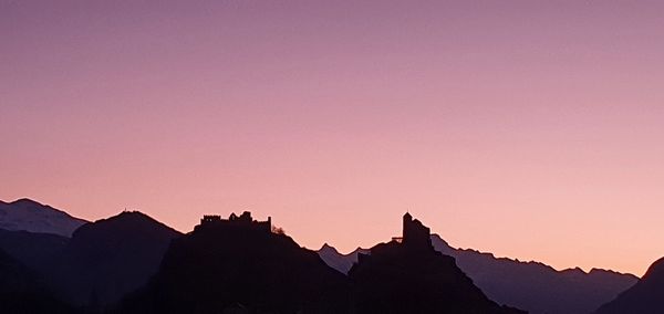 Silhouette of mountain range against clear sky