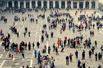 High angle view of people walking in city