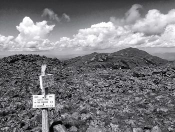 Scenic view of mountains against cloudy sky