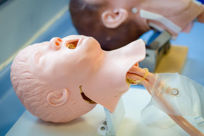 Close-up of baby holding chocolate cake
