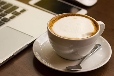 Close-up of coffee cup on table