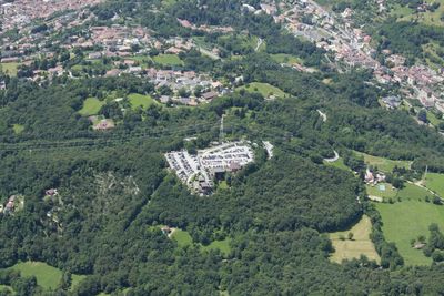 High angle view of trees and buildings in city