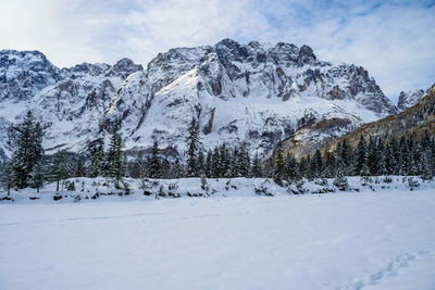 Scenic view of snow covered mountains against sky