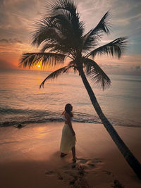 Full length of woman on beach during sunset