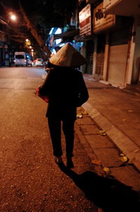 Full length of woman standing on city street