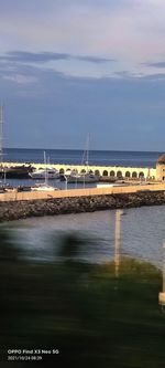 View of bridge over sea against sky