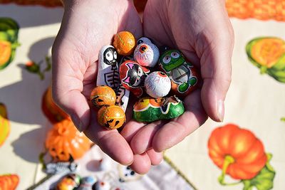 Midsection of person holding pumpkins halloween 