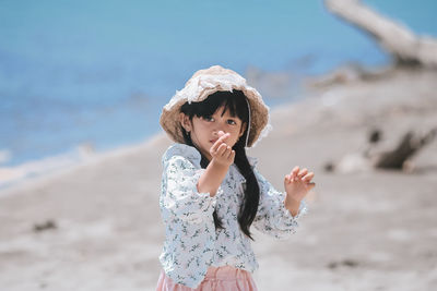 Full length of girl standing on beach