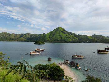 Scenic view of the beach against sky at kelor island, indonesia