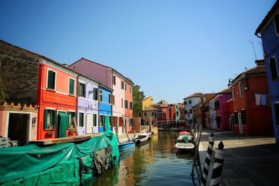 Boats moored in canal