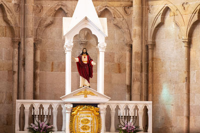 A statue of jesus on the altar