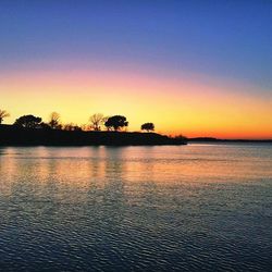 Scenic view of sunset over river