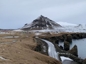 Scenic view of snowcapped mountain against sky