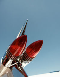 Low angle view of toy airplane against clear blue sky