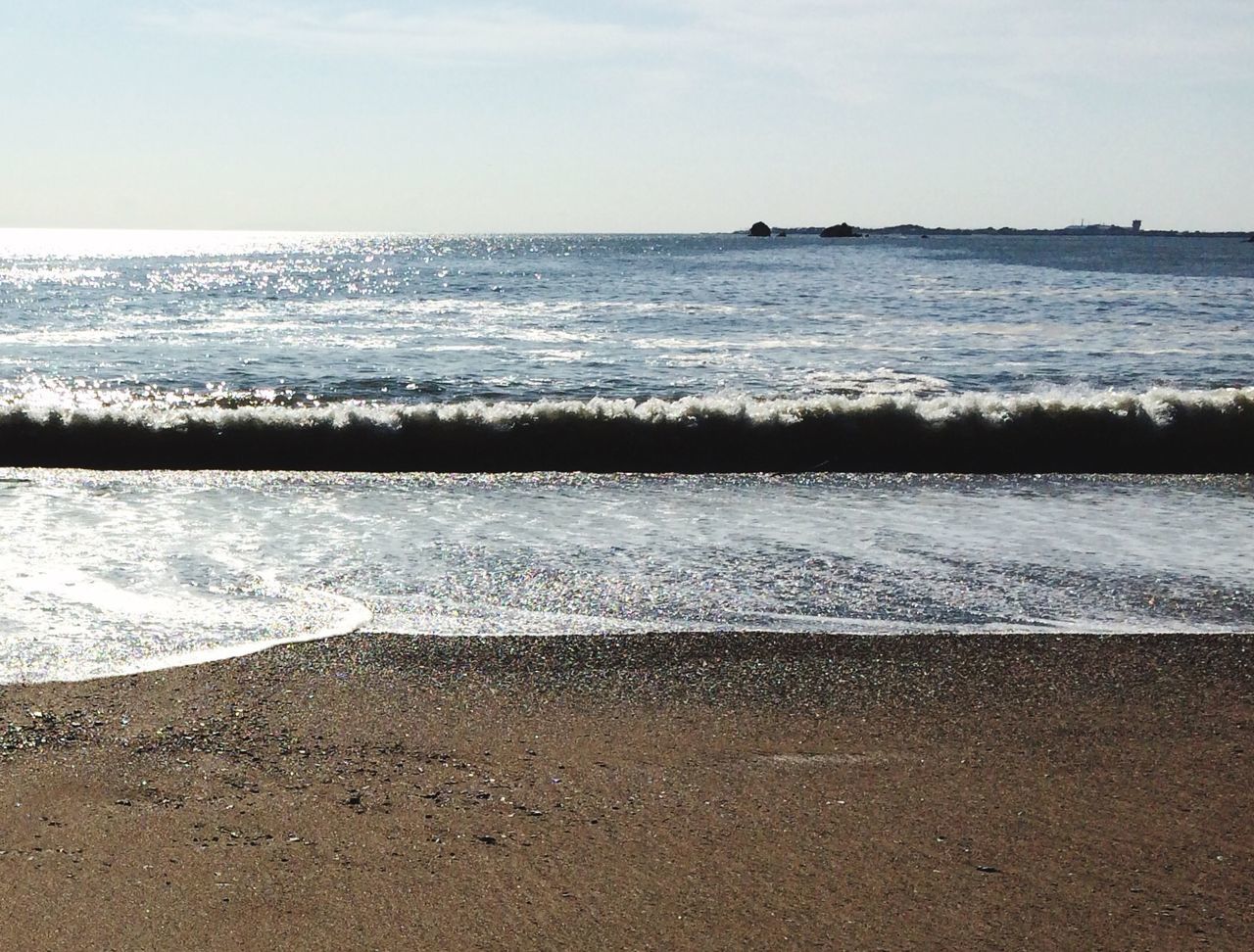 sea, beach, water, horizon over water, sand, shore, tranquil scene, tranquility, scenics, sky, beauty in nature, nature, idyllic, wave, coastline, day, remote, calm, outdoors, vacations