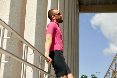 Low angle view of man standing on staircase