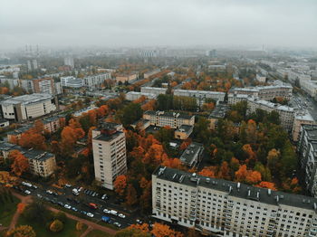 High angle view of buildings in city against sky