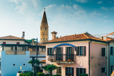 Exterior of buildings in town against sky